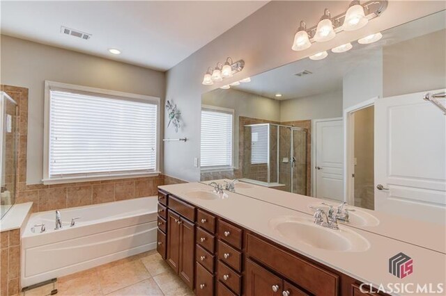 6706 Mill Rock Ct, Hoschton, GA 30548 - full bath with a shower stall, a bath, and vanity