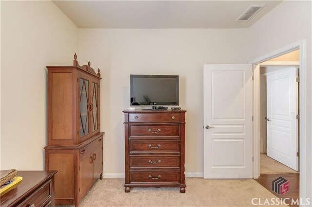 6706 Mill Rock Ct, Hoschton, GA 30548 - full bathroom with tile patterned floors, toilet, shower / bath combo with shower curtain, and vanity