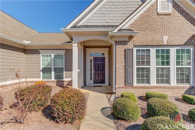 6706 Mill Rock Ct, Hoschton, GA 30548 - doorway to property featuring brick siding