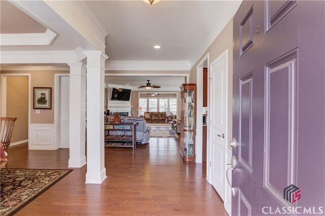 6706 Mill Rock Ct, Hoschton, GA 30548 - foyer entrance with french doors, a decorative wall, dark wood-style floors, and a wainscoted wall