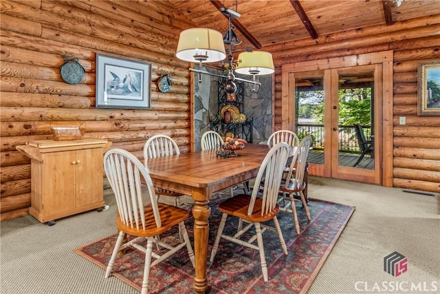 dining room with wood ceiling, french doors, vaulted ceiling with beams, and carpet floors
