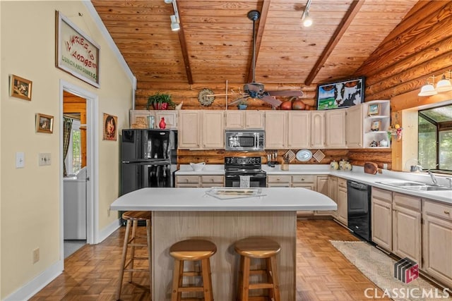 kitchen with a sink, vaulted ceiling with beams, black appliances, and wooden ceiling