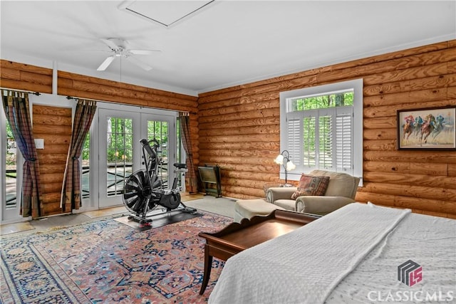bedroom featuring french doors, access to exterior, and rustic walls