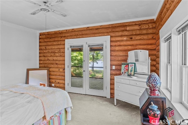 bedroom featuring french doors, access to exterior, light colored carpet, and log walls