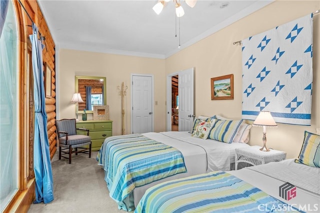 carpeted bedroom featuring crown molding
