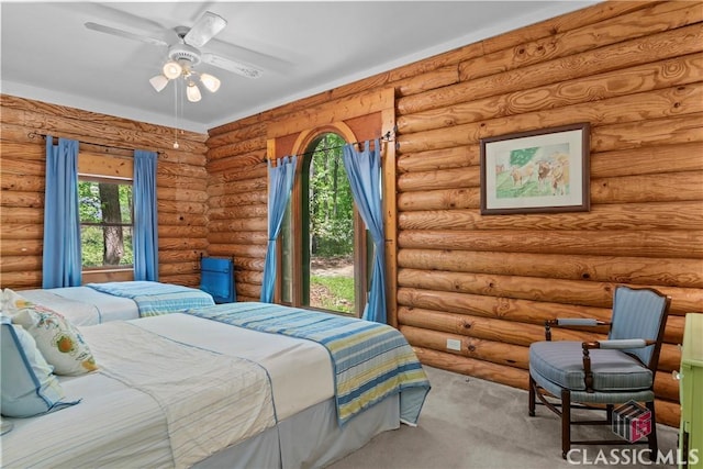 carpeted bedroom with rustic walls