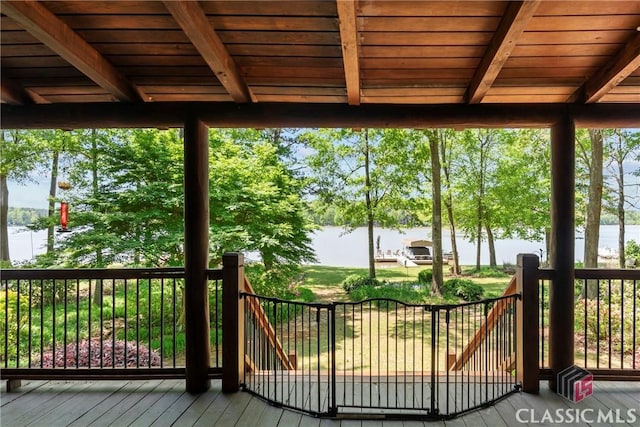 wooden deck with a water view