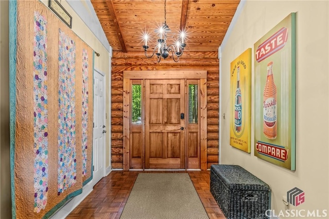 entrance foyer featuring wood ceiling, an inviting chandelier, and rustic walls
