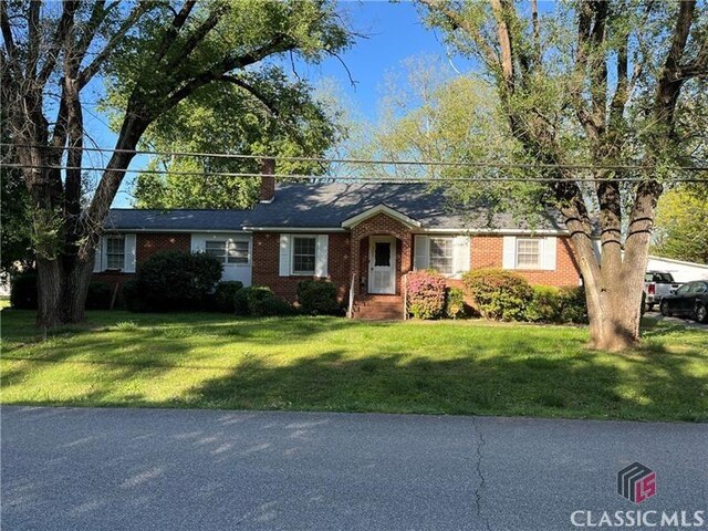 362 Sims St, Maysville, GA 30558 - ranch-style house featuring a front lawn, brick siding, and a chimney