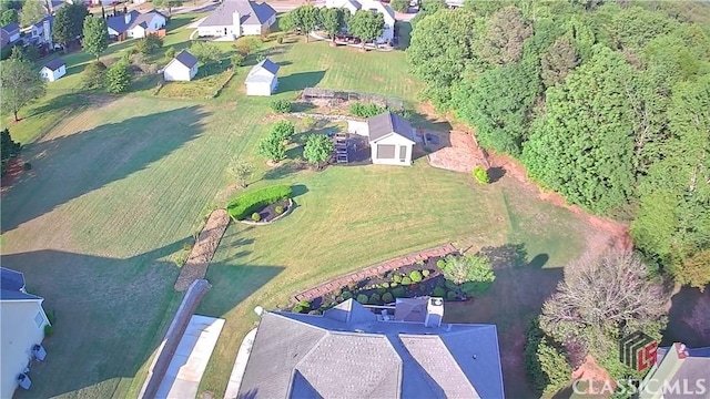 birds eye view of property with a residential view