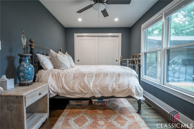bedroom with recessed lighting, a closet, dark wood-style flooring, baseboards, and a ceiling fan