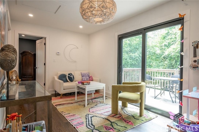 bedroom featuring wood finished floors, recessed lighting, access to exterior, and baseboards