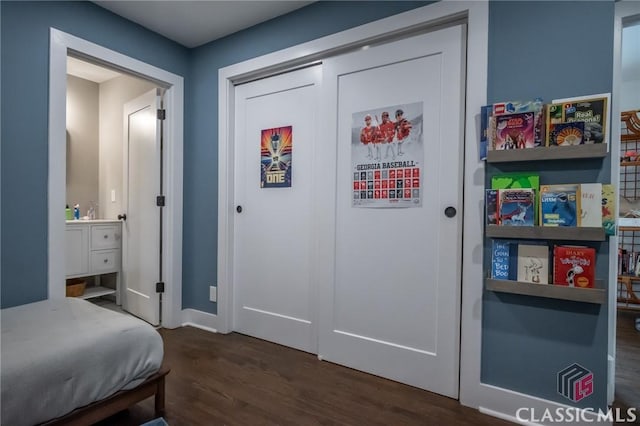 interior space featuring baseboards and dark wood-type flooring
