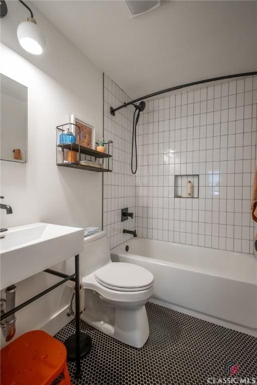 full bath with toilet, tile patterned flooring, and bathtub / shower combination