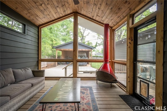 sunroom / solarium featuring outdoor lounge area