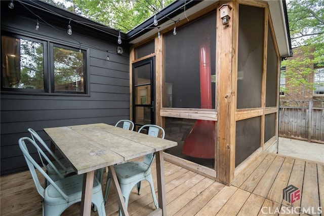 deck with outdoor dining area