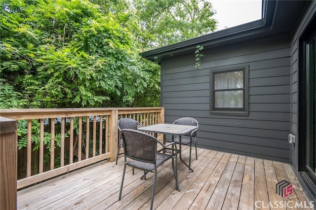 deck featuring outdoor dining area