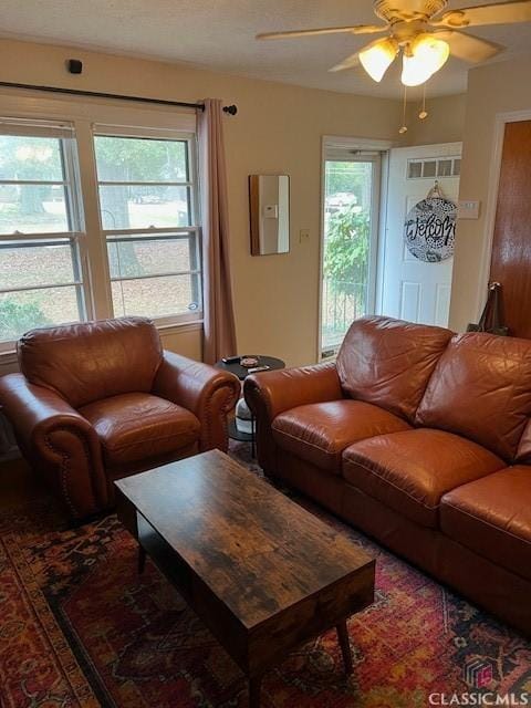 living area with ceiling fan