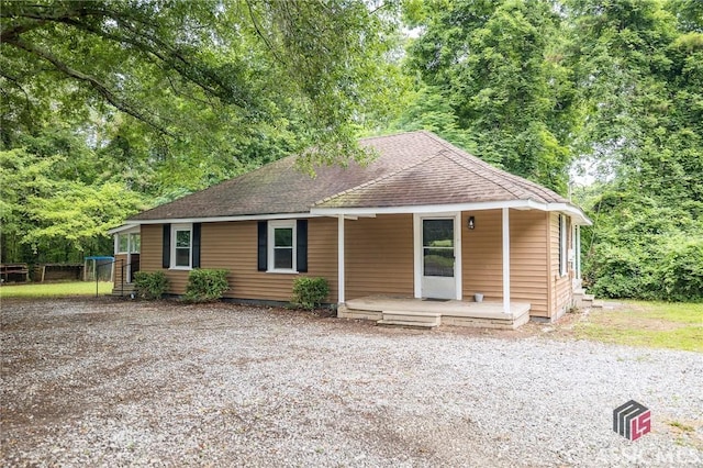 451 N Woodlawn Dr, Crawford, GA 30630 - ranch-style house with roof with shingles and a porch