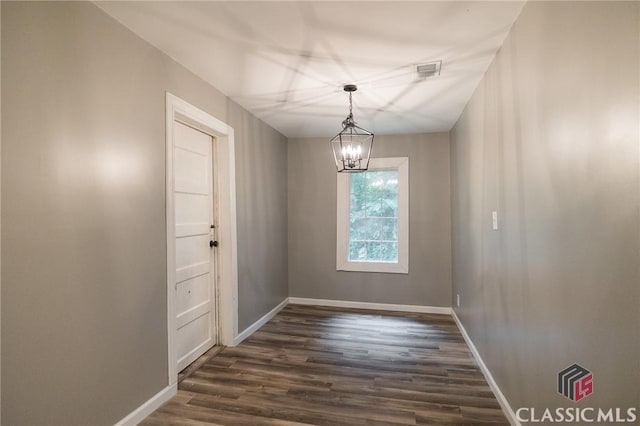 451 N Woodlawn Dr, Crawford, GA 30630 - unfurnished room featuring visible vents, baseboards, dark wood-style floors, and a notable chandelier