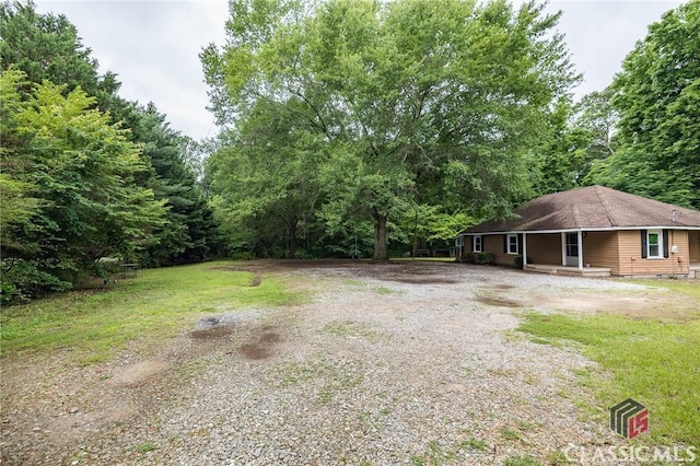 451 N Woodlawn Dr, Crawford, GA 30630 - view of yard featuring covered porch