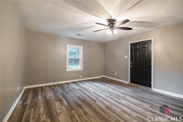 451 N Woodlawn Dr, Crawford, GA 30630 - unfurnished room with dark wood finished floors, visible vents, a ceiling fan, and baseboards