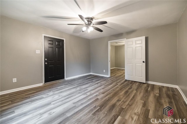 451 N Woodlawn Dr, Crawford, GA 30630 - spare room with baseboards, dark wood-style floors, and ceiling fan