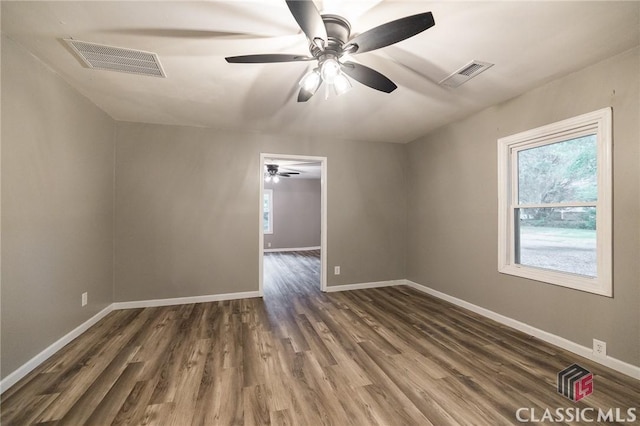 451 N Woodlawn Dr, Crawford, GA 30630 - unfurnished room featuring baseboards, visible vents, dark wood-style floors, and ceiling fan