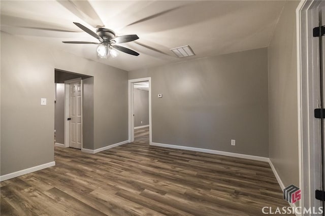 451 N Woodlawn Dr, Crawford, GA 30630 - unfurnished room featuring baseboards, a ceiling fan, visible vents, and dark wood-style floors