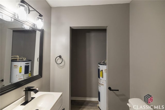 451 N Woodlawn Dr, Crawford, GA 30630 - half bath with water heater, wood finished floors, toilet, and vanity