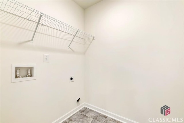 laundry room featuring washer hookup, baseboards, electric dryer hookup, and laundry area