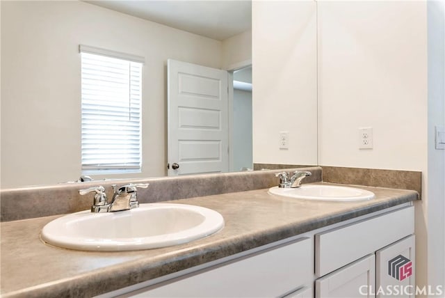 bathroom with a sink and double vanity