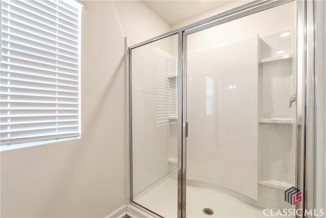 bathroom with a shower stall