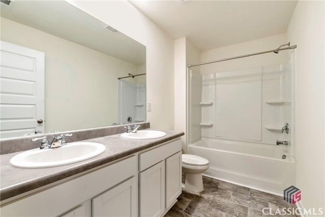bathroom with shower / bathtub combination, a sink, double vanity, and toilet
