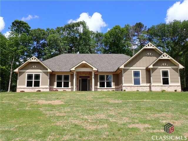 41 Hometown Ct, Jefferson, GA 30549 - craftsman house with roof with shingles, board and batten siding, and a front yard