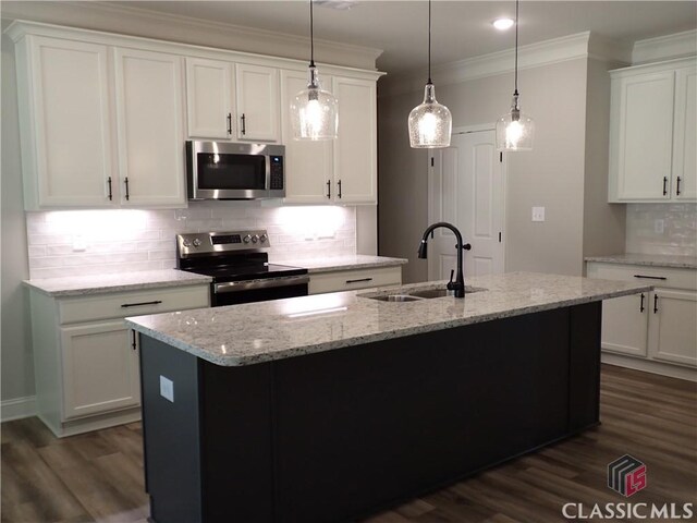 37 Hometown Ct, Jefferson, GA 30549 - kitchen featuring stainless steel appliances, backsplash, a sink, crown molding, and dark wood-style flooring