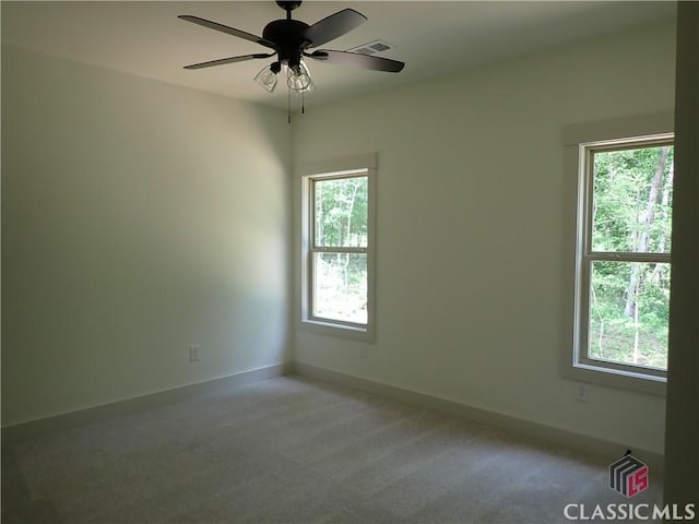45 Hometown Ct, Jefferson, GA 30549 - unfurnished room with light carpet, a ceiling fan, visible vents, and a wealth of natural light