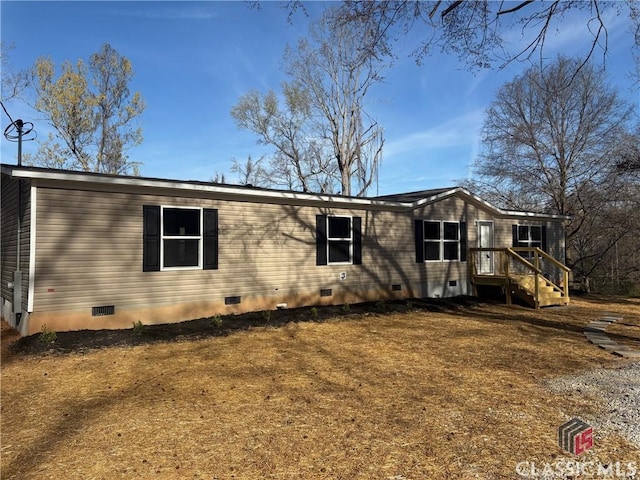 view of side of home featuring crawl space