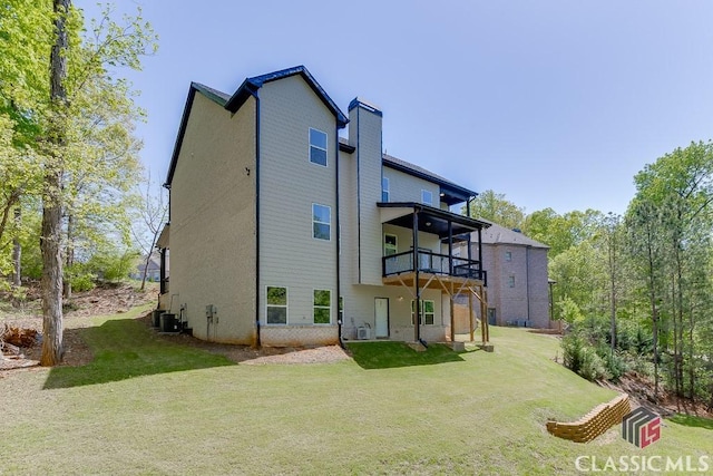4208 Sierra Creek Ct, Hoschton, GA 30548 - back of house featuring a lawn, a chimney, a balcony, and cooling unit