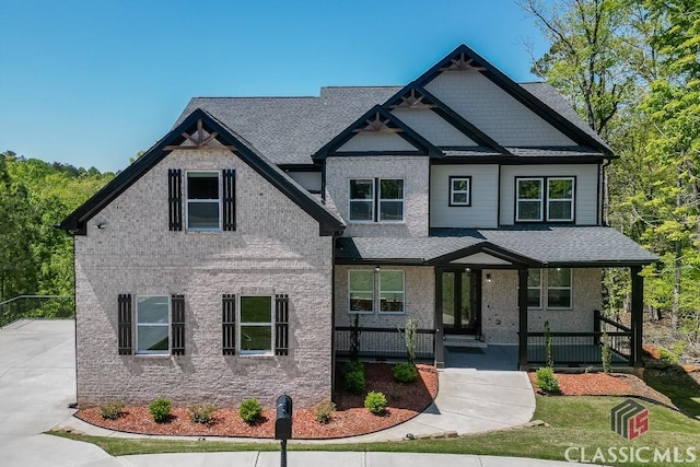 4208 Sierra Creek Ct, Hoschton, GA 30548 - craftsman-style home featuring a porch and roof with shingles