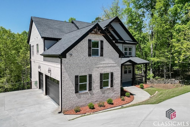 4208 Sierra Creek Ct, Hoschton, GA 30548 - view of front facade featuring driveway, an attached garage, a shingled roof, and brick siding