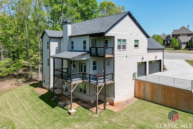 4208 Sierra Creek Ct, Hoschton, GA 30548 - rear view of house with a yard, a balcony, a chimney, driveway, and a shingled roof