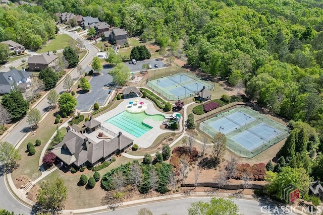 4208 Sierra Creek Ct, Hoschton, GA 30548 - aerial view of property's location featuring a pool and a heavily wooded area