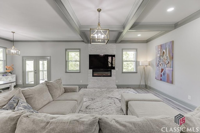 4208 Sierra Creek Ct, Hoschton, GA 30548 - living area with a chandelier, baseboards, beam ceiling, ornamental molding, and wood finished floors