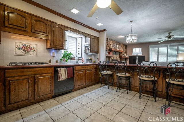 749 Diamond Hill Colbert Rd, Colbert, GA 30628 - kitchen featuring a wealth of natural light, a ceiling fan, a breakfast bar area, and black dishwasher