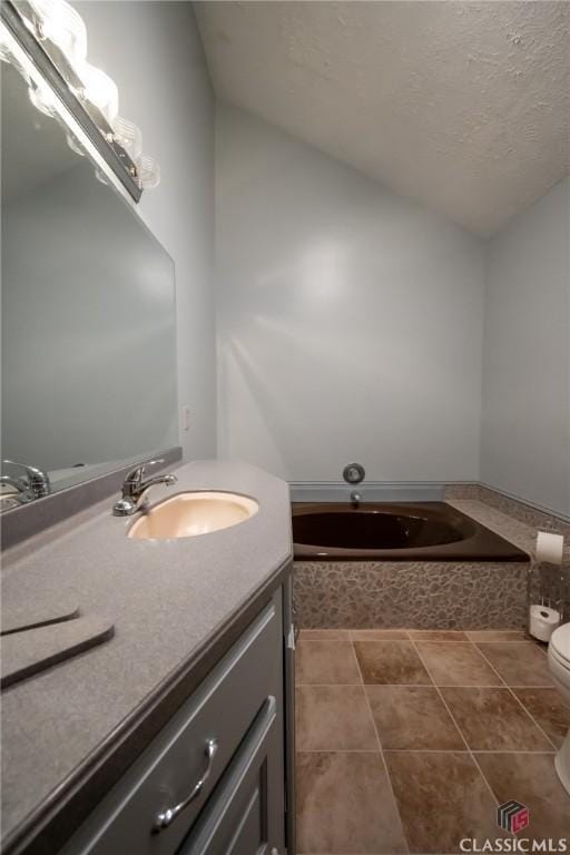 749 Diamond Hill Colbert Rd, Colbert, GA 30628 - full bathroom with lofted ceiling, toilet, a garden tub, vanity, and tile patterned flooring