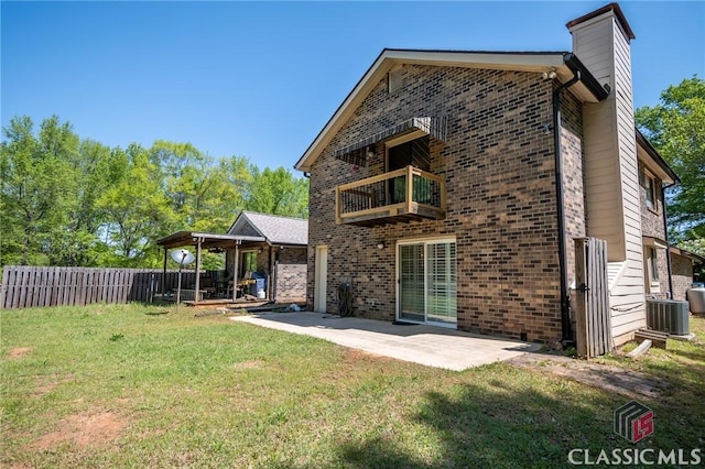 749 Diamond Hill Colbert Rd, Colbert, GA 30628 - rear view of house featuring a patio area, a balcony, a lawn, brick siding, and fence