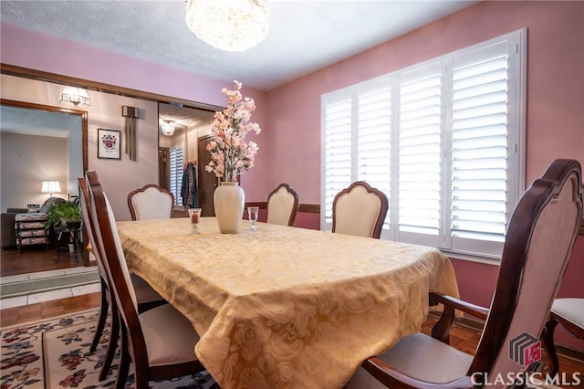 749 Diamond Hill Colbert Rd, Colbert, GA 30628 - dining space with wood finished floors and a notable chandelier