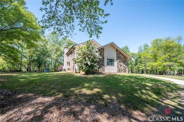 749 Diamond Hill Colbert Rd, Colbert, GA 30628 - view of side of property featuring a lawn, stone siding, and a chimney