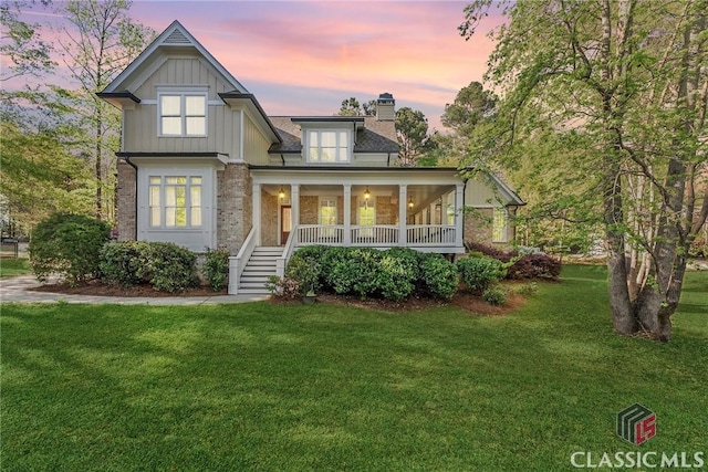 147 Rapids Dr, Bogart, GA 30622 - craftsman house with a chimney, covered porch, and a front yard